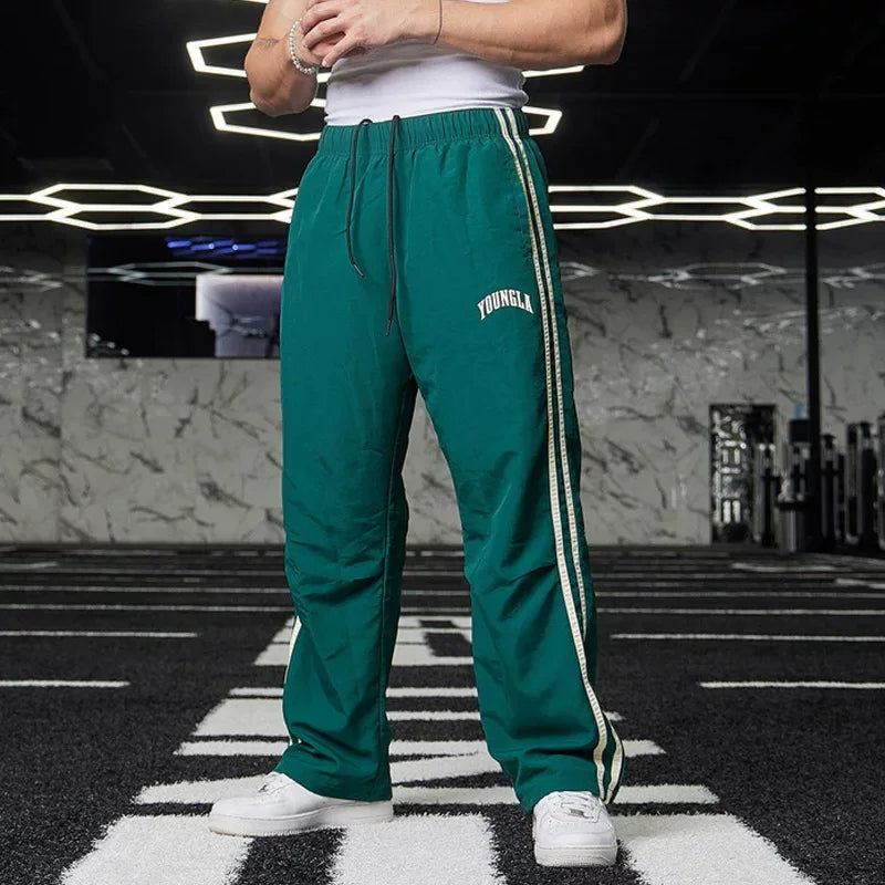 American style trendy sports pants with loose elastic and breathable two bar casual fitness and quick drying European design